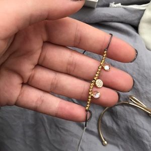 Purple string with gold and silver accents